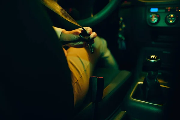 Close Female Driver Fastening Seatbelt While Driving Car Night — 스톡 사진