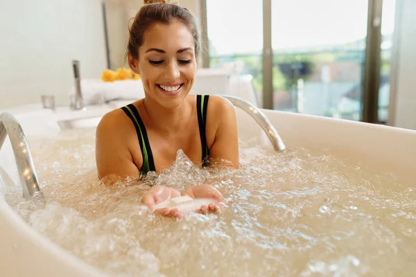 Young Happy Woman Using Aromatic Bath Salt While Having Hydromassage — Φωτογραφία Αρχείου