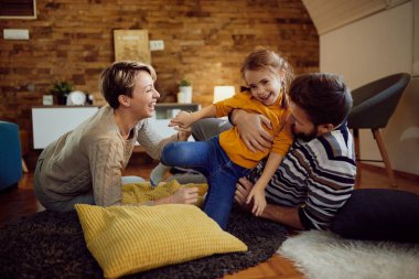 Carefree family having fun while playing at home. 