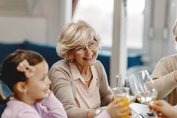 Happy Mature Woman Having Fun Her Family While Toasting Meal — Stockfoto
