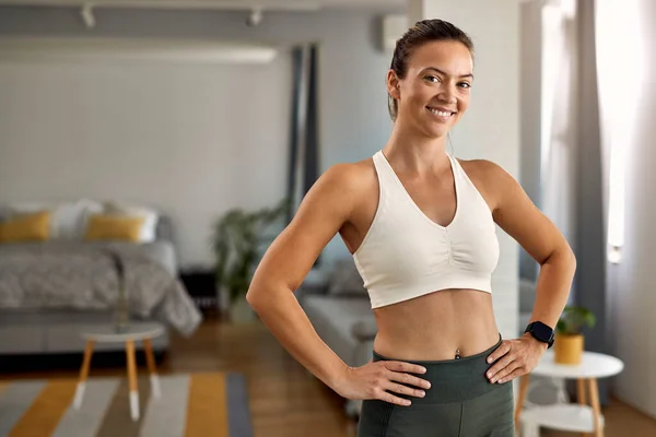 Portrait Young Happy Sportswoman Standing Her Living Room Looking Camera — Stockfoto