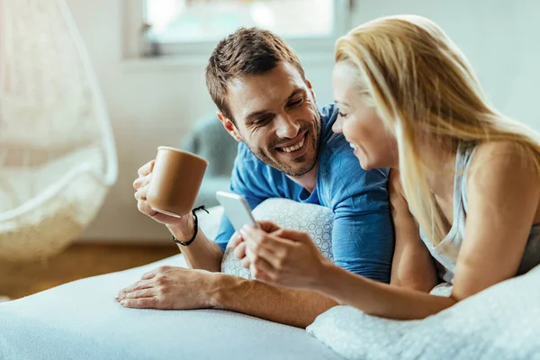Happy Man Drinking Morning Coffee Communicating His Girlfriend Who Using — Foto de Stock