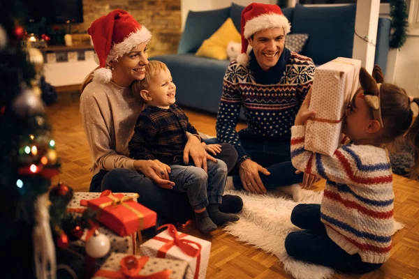 Happy Family Exchanging Christmas Presents Having Fun Evening Home — Zdjęcie stockowe