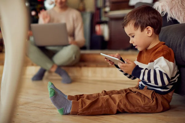 Small Boy Surfing Net Touchpad While Sitting Floor Home Christmas — Stockfoto