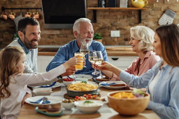 Happy Multi Generation Family Toasting While Enjoying Lunch Dining Room — Foto Stock