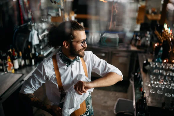 Young Happy Bartender Cleaning Drinking Glasses Work Bar — Stok fotoğraf