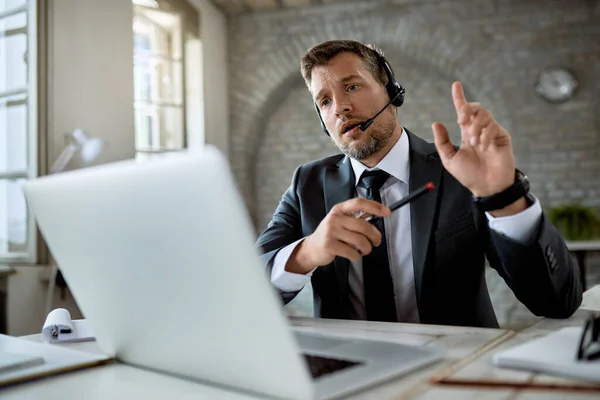 View Businessman Wearing Headset While Making Video Call Laptop Office — ストック写真