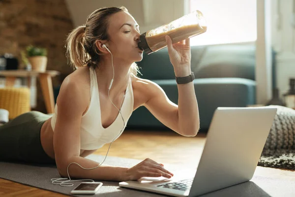Young Athletic Woman Drinking Protein Shake While Lying Floor Using — Photo