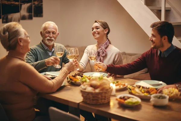 Happy Family Toasting Wine While Gathering Dining Table Home — Zdjęcie stockowe