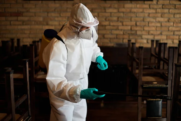 Disinfection Worker Hazmat Suit Spraying Contaminated Pub Due Covid Pandemic — Stock fotografie