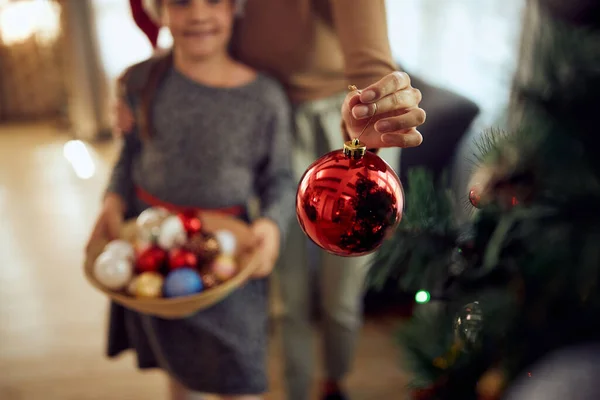 Close Mother Holding Christmas Ornament While Decorating Christmas Tree Her — ストック写真