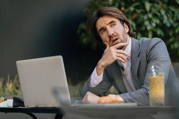 Young Entrepreneur Thinking Something While Sitting Outdoor Cafe Looking Away — Photo