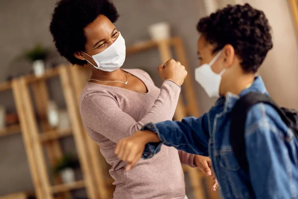 Happy African American Mother Son Protective Face Masks Elbow Bumping — Foto Stock