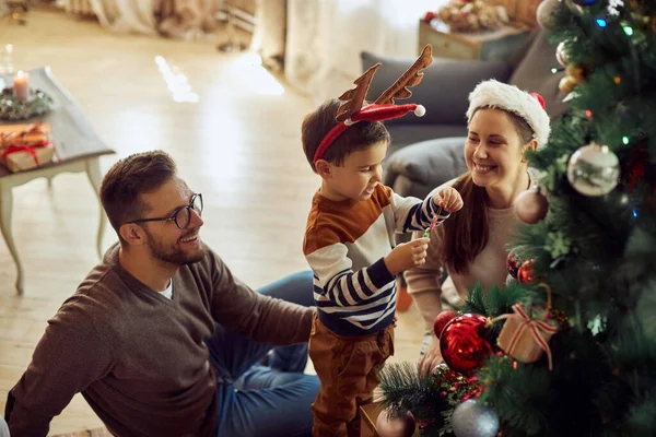 Happy Little Boy His Parents Decorating Christmas Tree Together Home — Zdjęcie stockowe