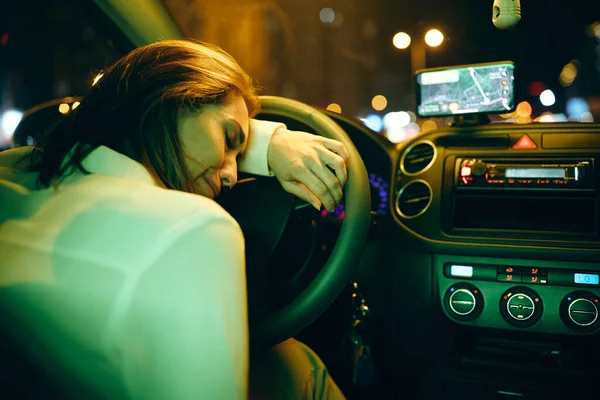 Young Depressed Woman Leaning Steering Wheel Crying While Driving Car — стоковое фото