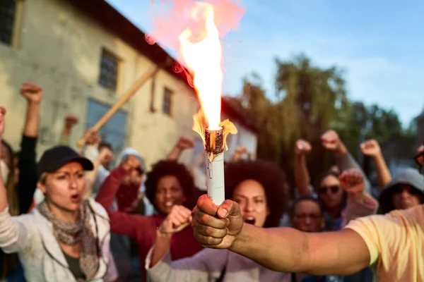 Close Protester Holding Inflamed Torch While Crowd People Shouting Background —  Fotos de Stock
