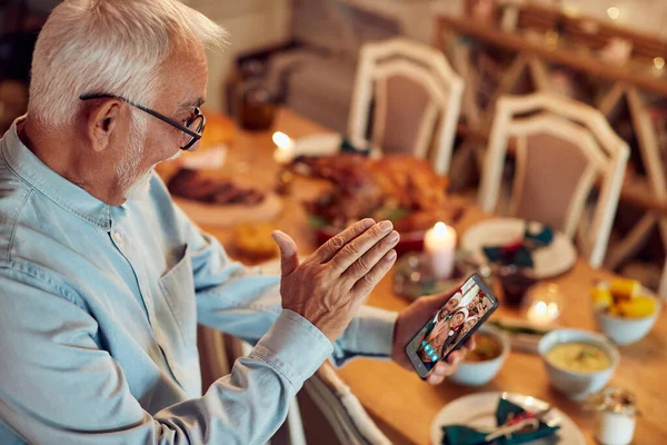 Happy Mature Man Using Smart Phone Waving His Family Video — Zdjęcie stockowe