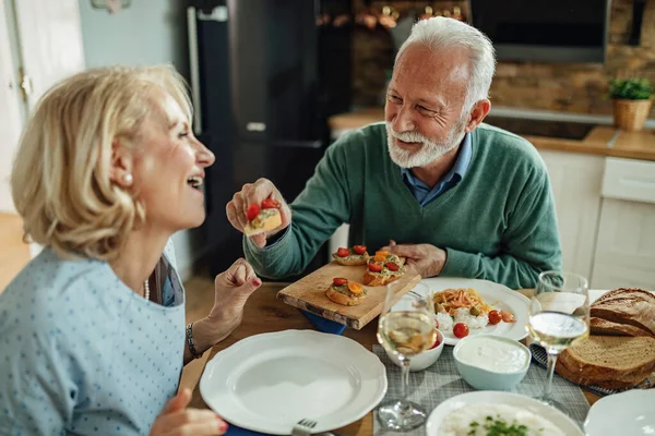 Happy Senior Couple Having Fun Meal Dining Table Focus Man — Foto de Stock