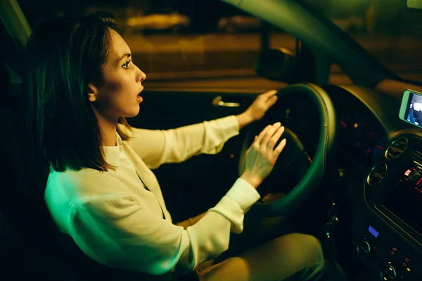 Young Woman Steering Wheel Honking While Driving Car Night — 图库照片