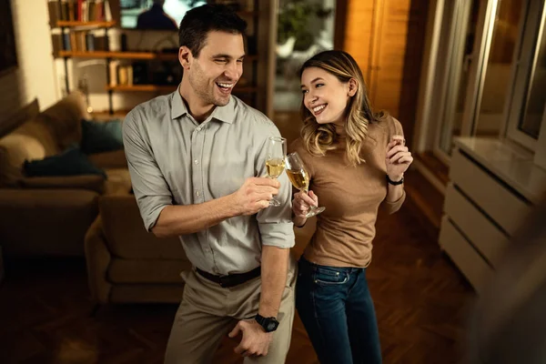 Happy Couple Having Fun While Dancing Toasting Champagne Evening Home — стоковое фото