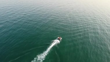 Aerial view of Fast, Racing and Sports Boats in the Ocean, High Angle footage of Beach of Bournemouth City of England UK
