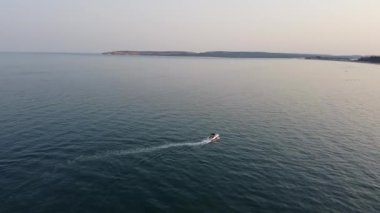 Aerial view of Fast, Racing and Sports Boats in the Ocean, High Angle footage of Beach of Bournemouth City of England UK