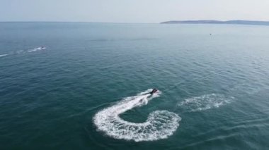 Aerial view of Fast, Racing and Sports Boats in the Ocean, High Angle footage of Beach of Bournemouth City of England UK