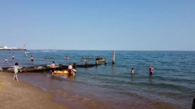 People are Enjoying Hot Weather of Summer at Bournemouth Beach of England UK