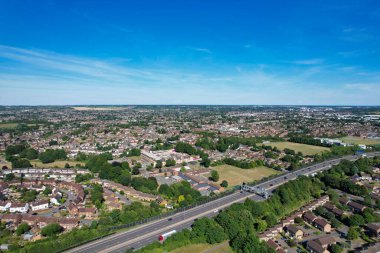 High Angle aerial view of British Roads and Traffic Passing through countryside of England UK
