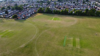 Aerial footage by drone high angle view of London Luton City of England with Buildings
