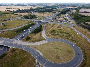 Aerial View and High Angle Footage of British Motorways Interchange of M1 Junction 11a at North Luton City of England UK.