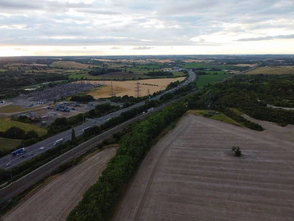 High Angle Drone\'s Camera high angle View of railway Tracks at Motorways Junction of Luton England UK