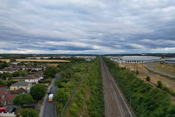 High Angle Drone\'s Camera high angle View of railway Tracks at Motorways Junction of Luton England UK