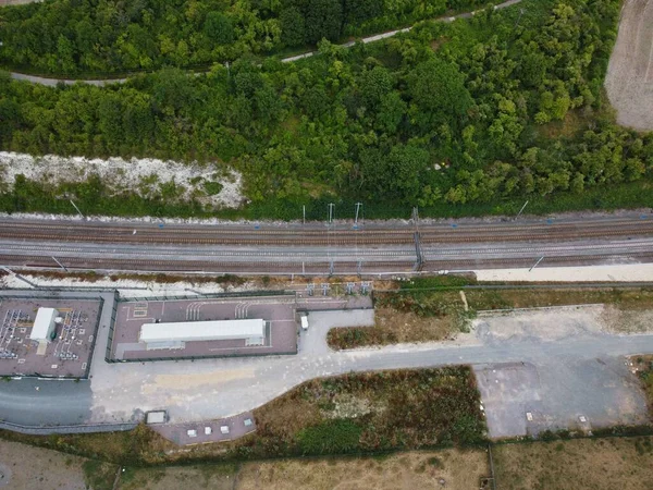 High Angle Drone\'s Camera high angle View of railway Tracks at Motorways Junction of Luton England UK