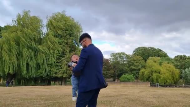 Asian Pakistani Father Holding His Months Old Infant Local Park — Videoclip de stoc