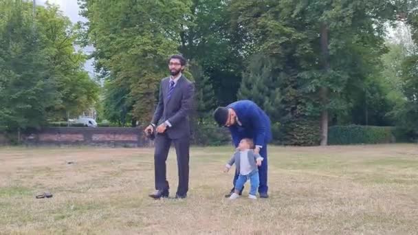Young Asian Males Walking Infant Baby Boy Local Public Park — стокове відео