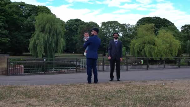 Young Asian Males Walking Infant Baby Boy Local Public Park — Vídeo de Stock