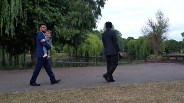 Young Asian Males Walking Infant Baby Boy Local Public Park — Vídeo de stock