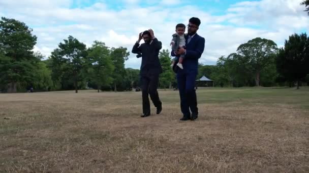 Young Asian Males Walking Infant Baby Boy Local Public Park — Αρχείο Βίντεο