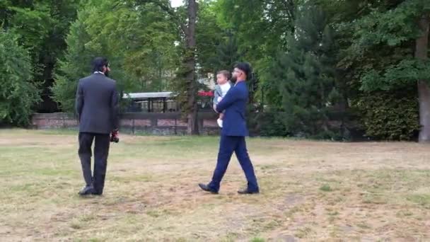 Young Asian Males Walking Infant Baby Boy Local Public Park — Vídeo de stock