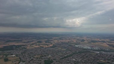 Beautiful High Angle Altitude View of Clouds and British Town of England UK, Air plane view at 360 degree.
