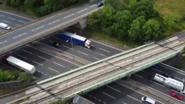 High Angle aerial view of  British Roads and Traffic Passing through Luton City and countryside of England UK