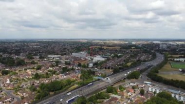 High Angle aerial view of  British Roads and Traffic Passing through Luton City and countryside of England UK