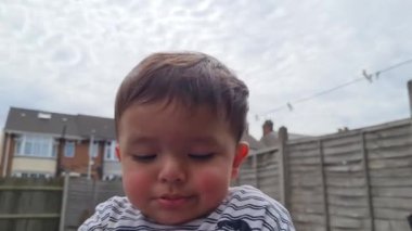 Cute Asian Pakistani Baby Boy is Playing and Posing