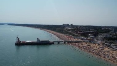 People are enjoying and relaxing at Bournemouth sandy Beach of England UK, beautiful British Sea View and Clean Ocean of Great Britain