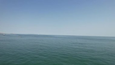 People are enjoying and relaxing at Bournemouth sandy Beach of England UK, beautiful British Sea View and Clean Ocean of Great Britain