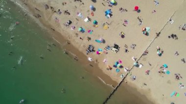 People are enjoying and relaxing at Bournemouth sandy Beach of England UK, beautiful British Sea View and Clean Ocean of Great Britain