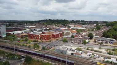 Aerial footage and high angle Train on Tracks at Central Luton Railway Station and City Centre of Luton Town of England UK