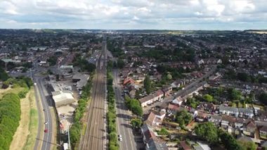 Aerial footage and high angle view of Train on Tracks at Leagrave Luton City  Railway Station and Town of England UK