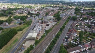 Aerial footage and high angle view of Train on Tracks at Leagrave Luton City  Railway Station and Town of England UK